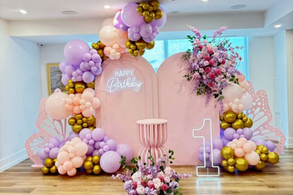 Luxury butterfly theme birthday stage setup with lights and flowers